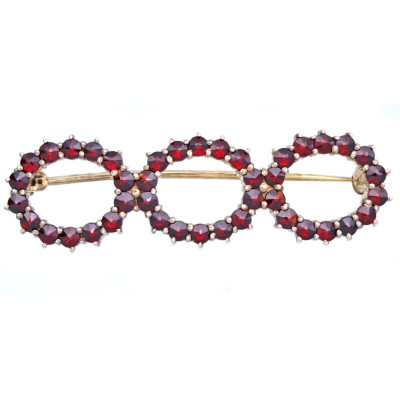 Stříbrná brož s granáty